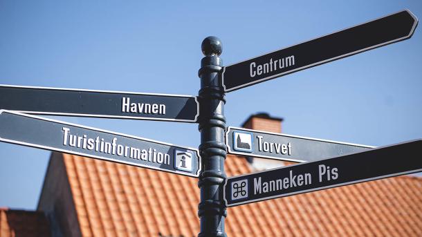 Signs in the street show the way to Bogense's attractions